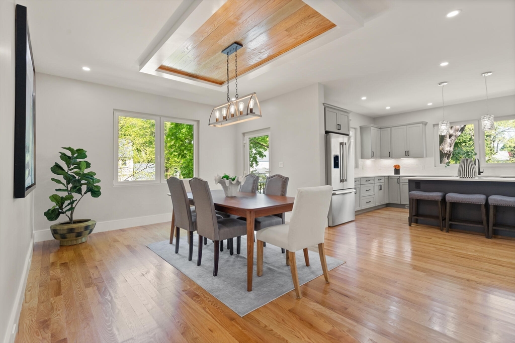 33 Barbara Road Newton, MA 02465 - Photo 9 of 42 a view of a dining room with furniture window and wooden floor