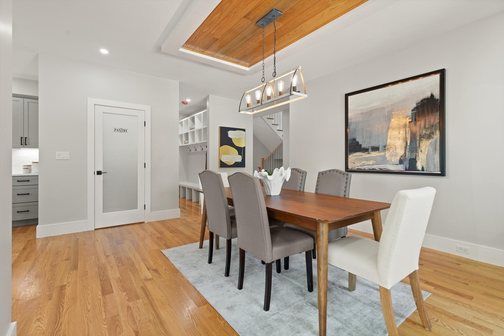 33 Barbara Road Newton, MA 02465 - Photo 10 of 42 a view of a dining room with furniture and wooden floor