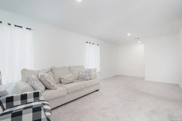 a living room with furniture and a couch
