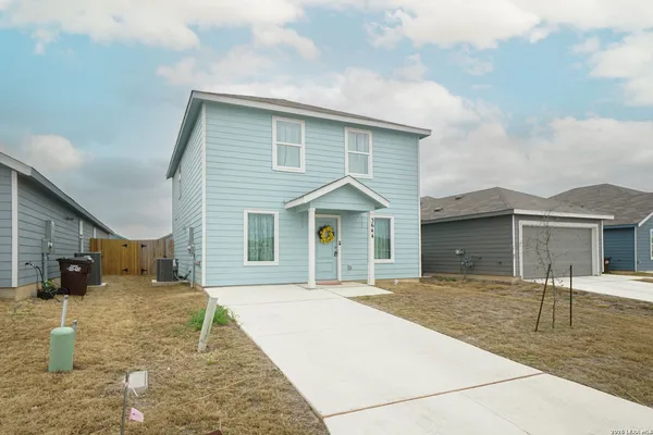 a front view of a house with yard