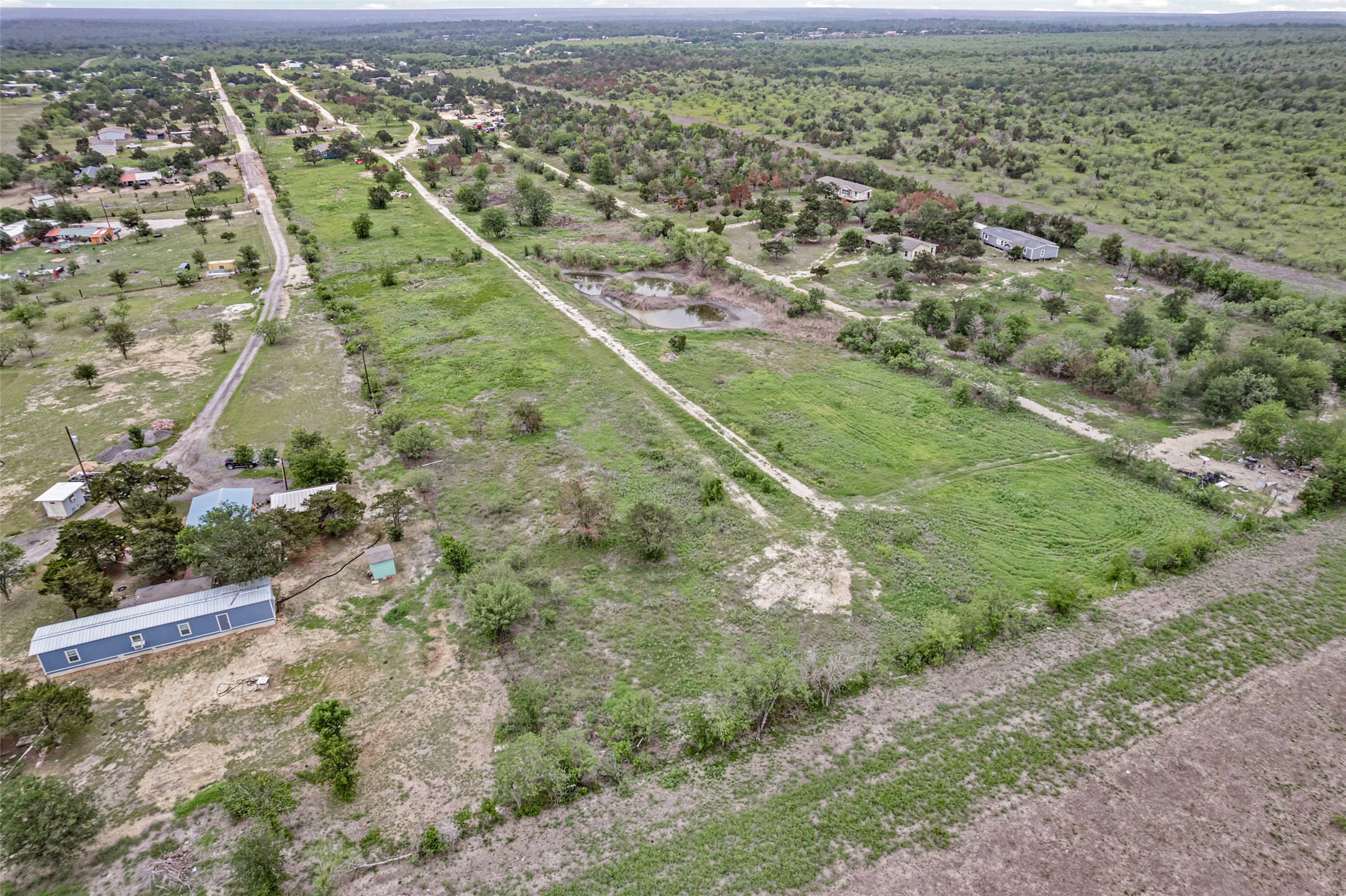 11622 Doyle Overton Road Austin, TX 78719 - Photo 15 of 20 an aerial view of residential houses with outdoor space