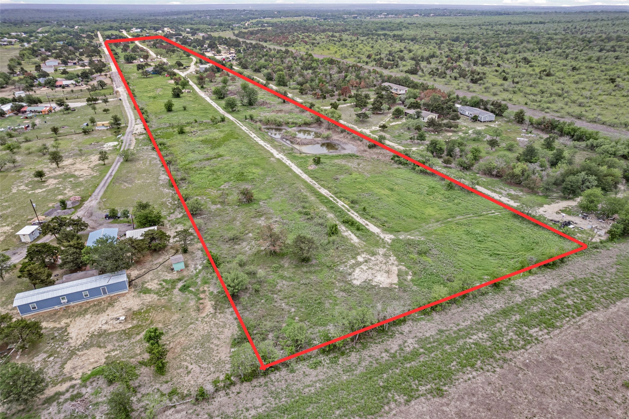 11622 Doyle Overton Road Austin, TX 78719 - Photo 16 of 20 a view of a yard with a large tree
