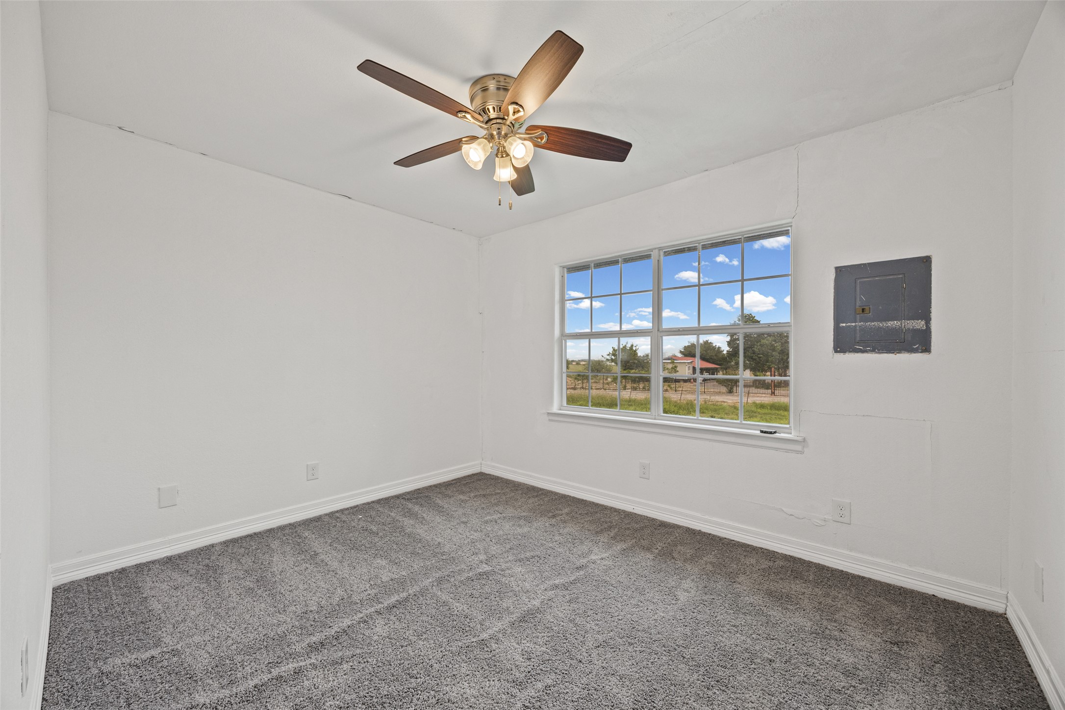 11622 Doyle Overton Road Austin, TX 78719 - Photo 4 of 20 a view of an empty room with a window