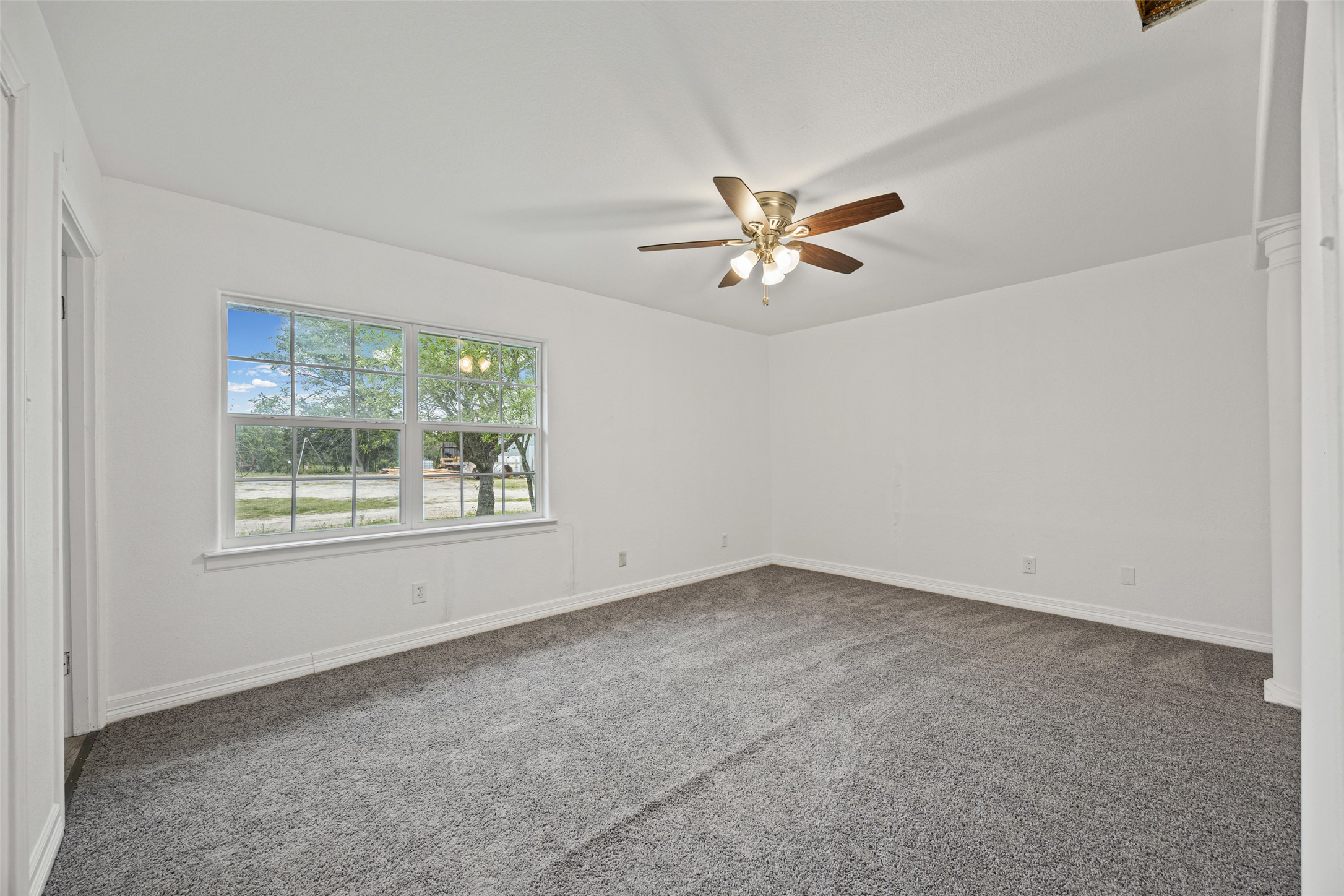 11622 Doyle Overton Road Austin, TX 78719 - Photo 5 of 20 an empty room with a window