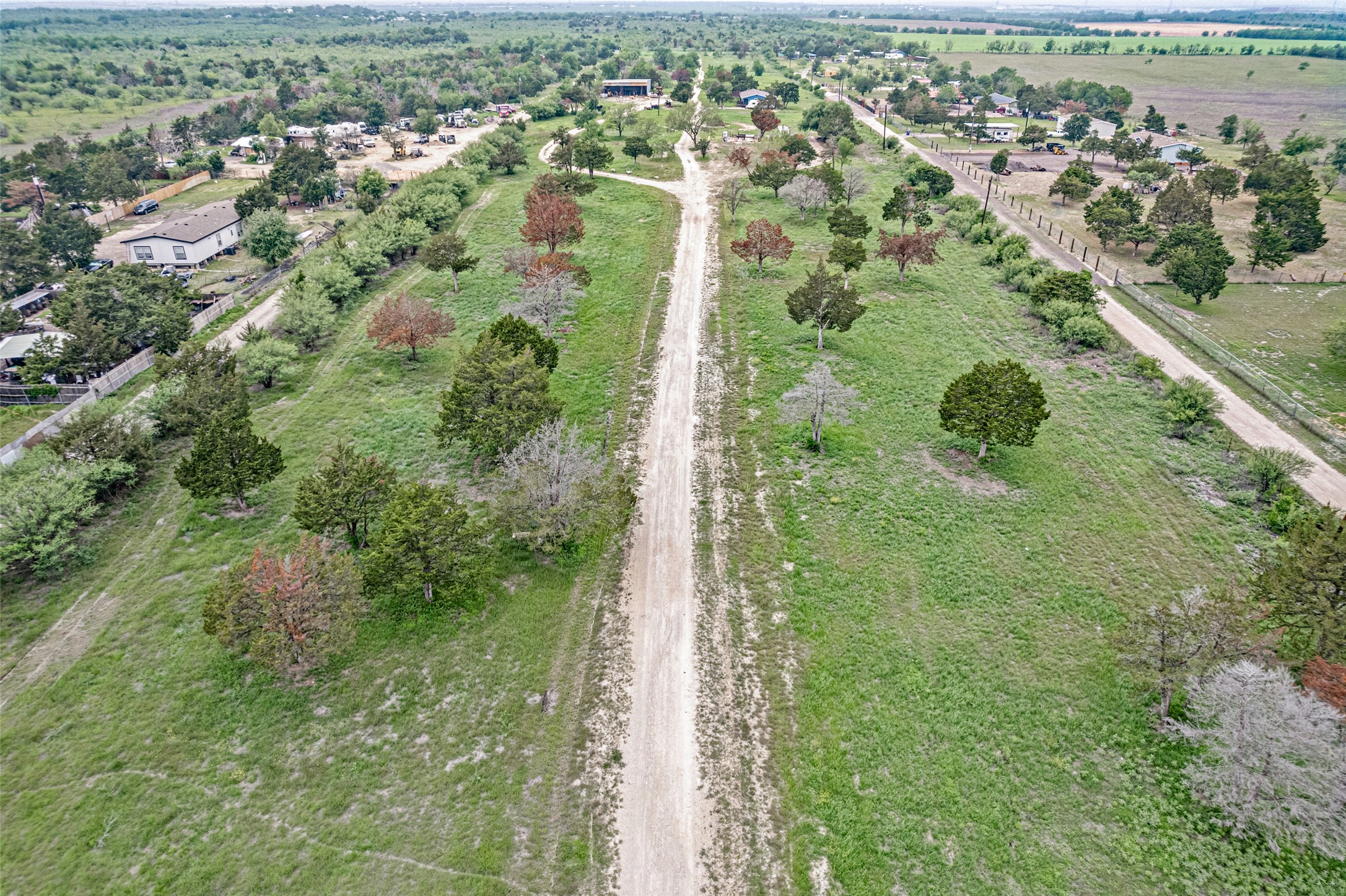 11622 Doyle Overton Road Austin, TX 78719 - Photo 10 of 20 an aerial view of residential houses with outdoor space and trees