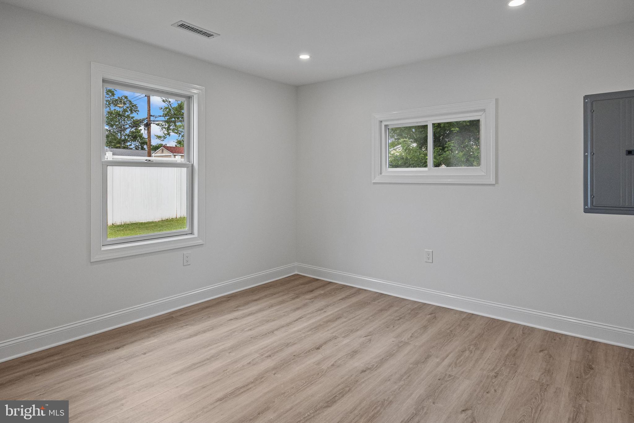 28 Gamewood Road Levittown, PA 19057 - Photo 6 of 28 a view of an empty room with wooden floor and a window