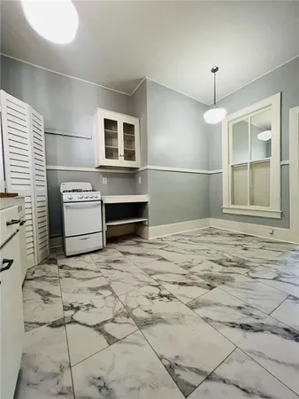 a room with natural light and appliances