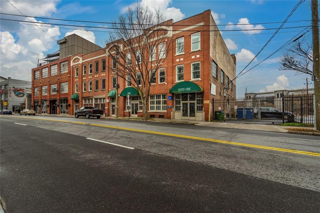 a view of a building with a street