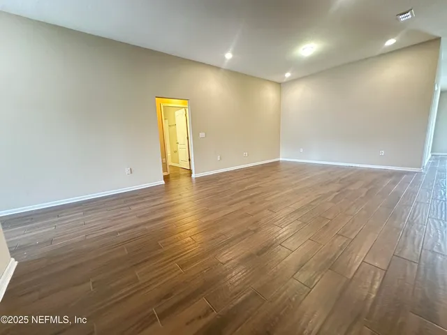 a bathroom with a sink a toilet and a large mirror