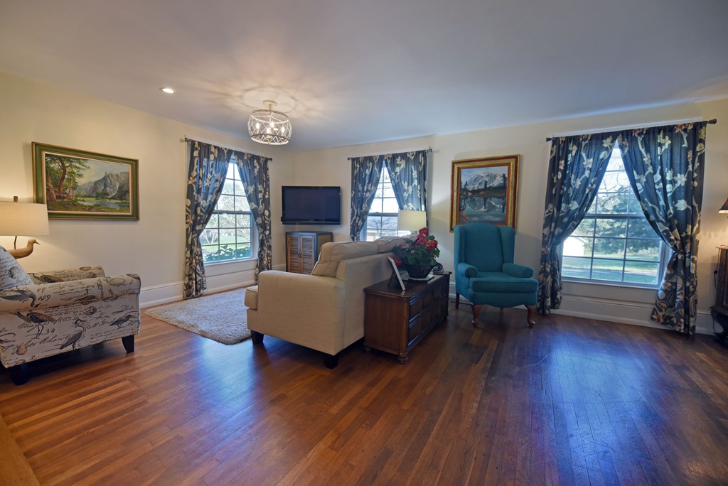 63 Loving Road Morganton, GA 30560 - Photo 19 of 58 a living room with furniture and a large window