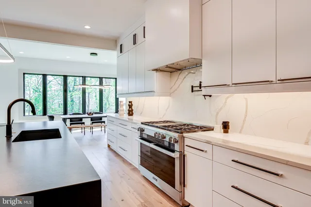 a large white kitchen with lots of counter space