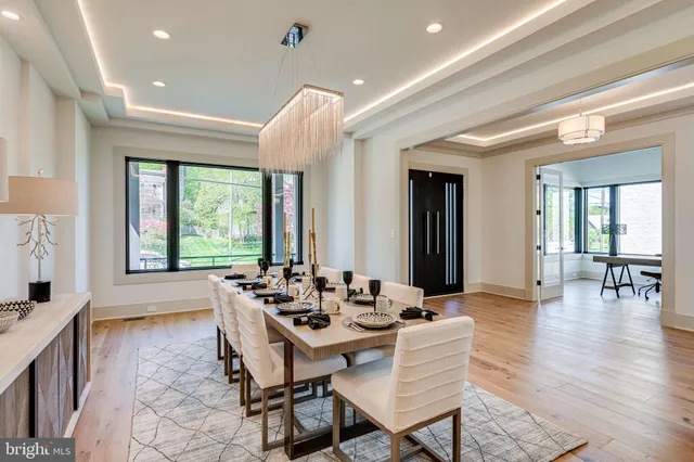 a dining room with furniture and wooden floor