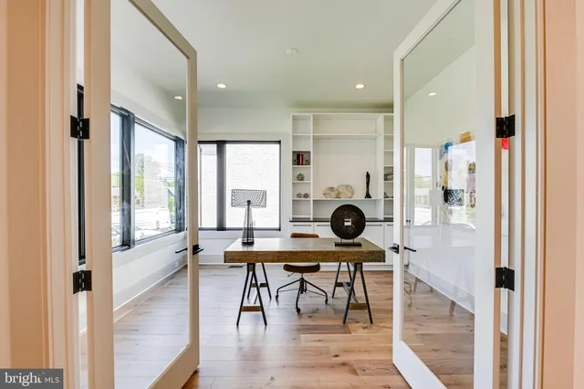 a view of a dining room with furniture and a large window