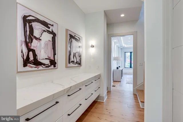 a room with two chair and a large window