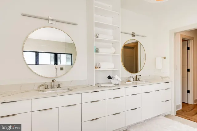 a living room with furniture window and stainless steel appliances