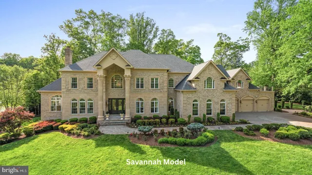 a front view of a house with a garden and plants