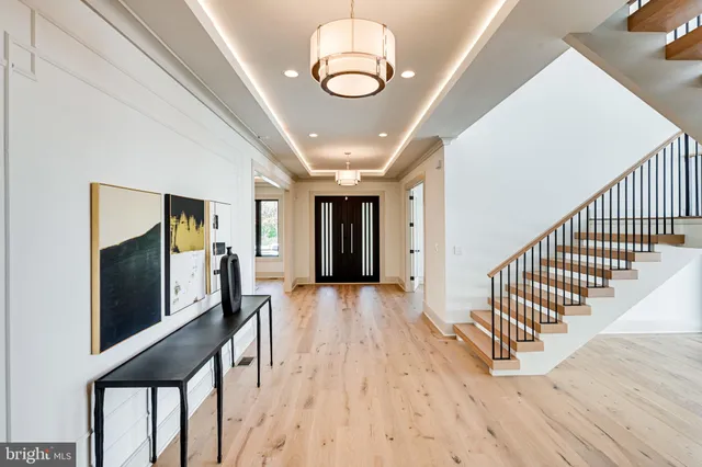 a outdoor living space with furniture and a chandelier