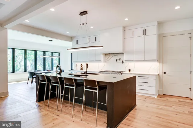 a kitchen with window and cabinets