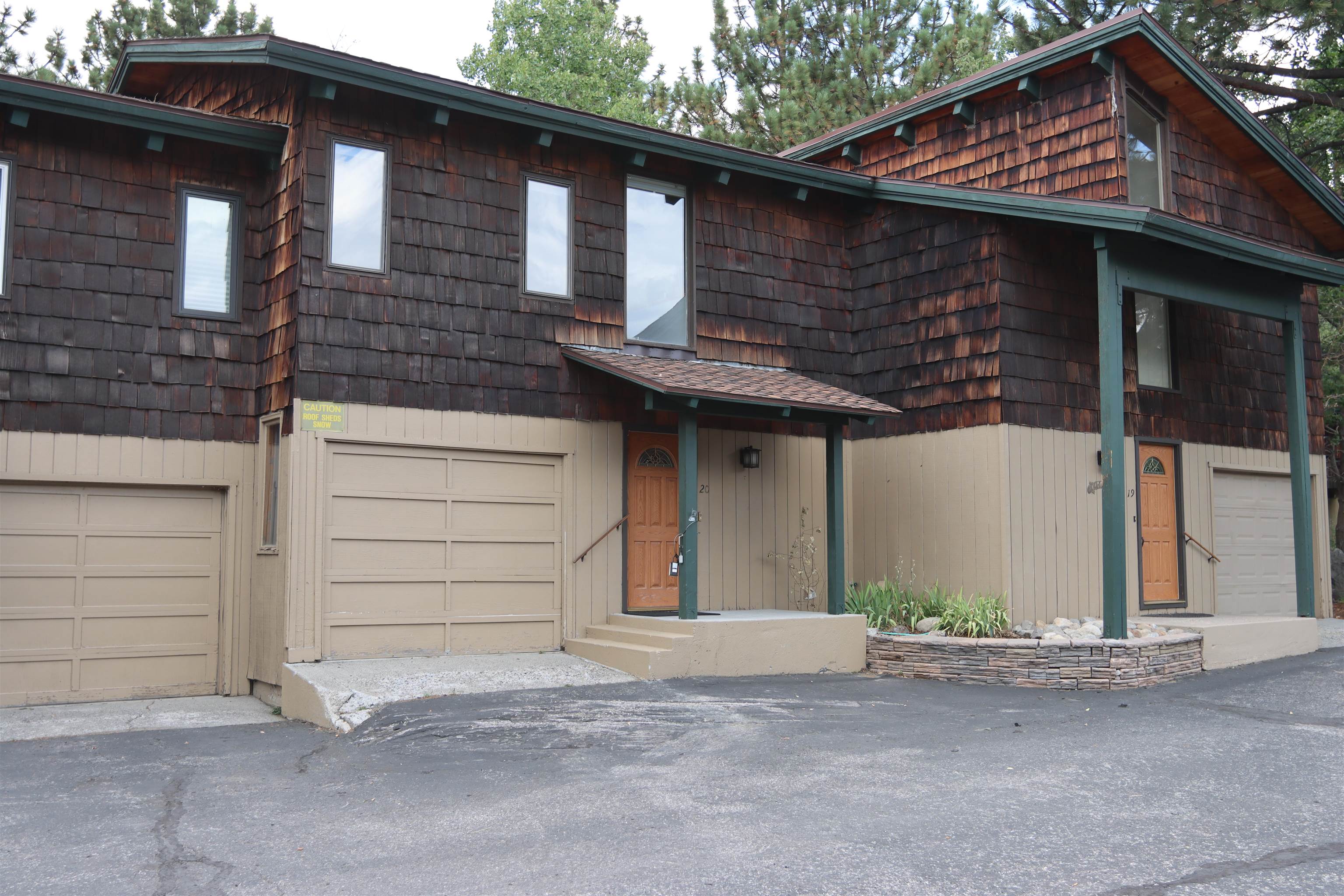 3199 Chateau Road, Unit 20 Mammoth Lakes, CA 93546 - Photo 1 of 37 View of front facade featuring an attached garage