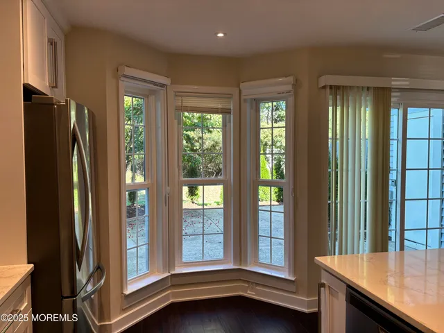 a view of a kitchen with furniture and a window
