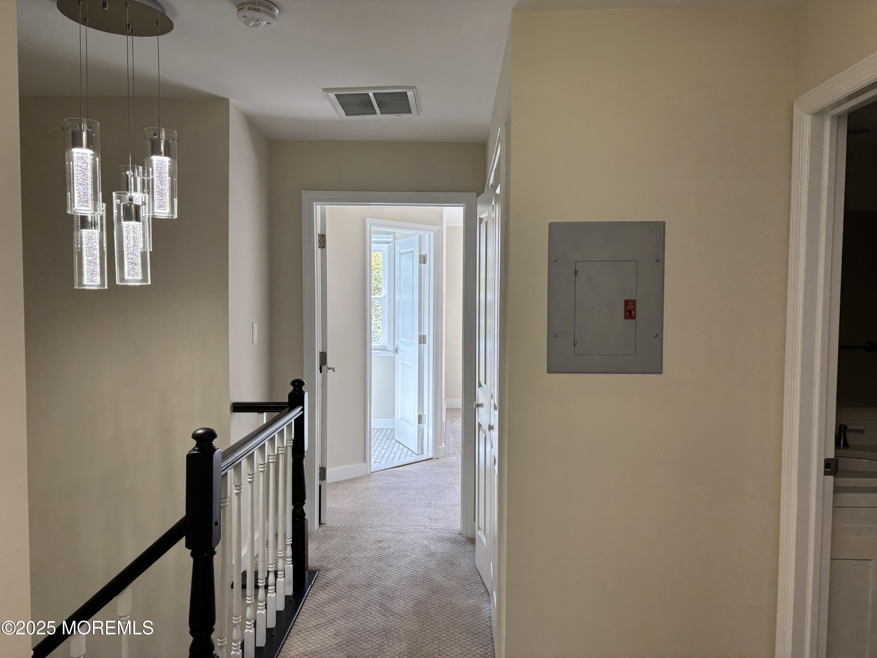 276 Sugar Maple Court Howell, NJ 07731 - Photo 15 of 34 a view of a hallway with wooden floor and staircase