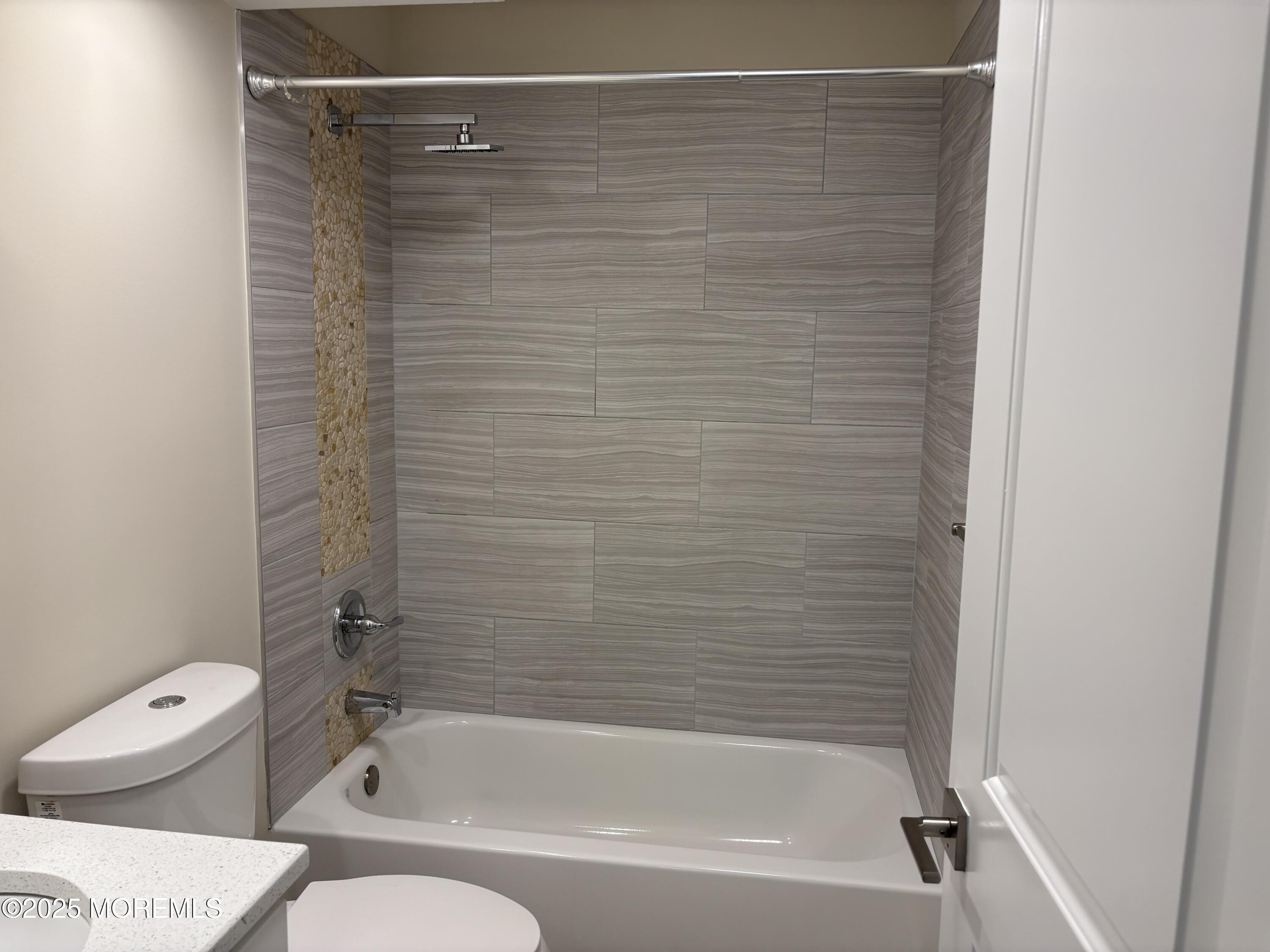 276 Sugar Maple Court Howell, NJ 07731 - Photo 17 of 34 a bathroom with a shower and a white toilet