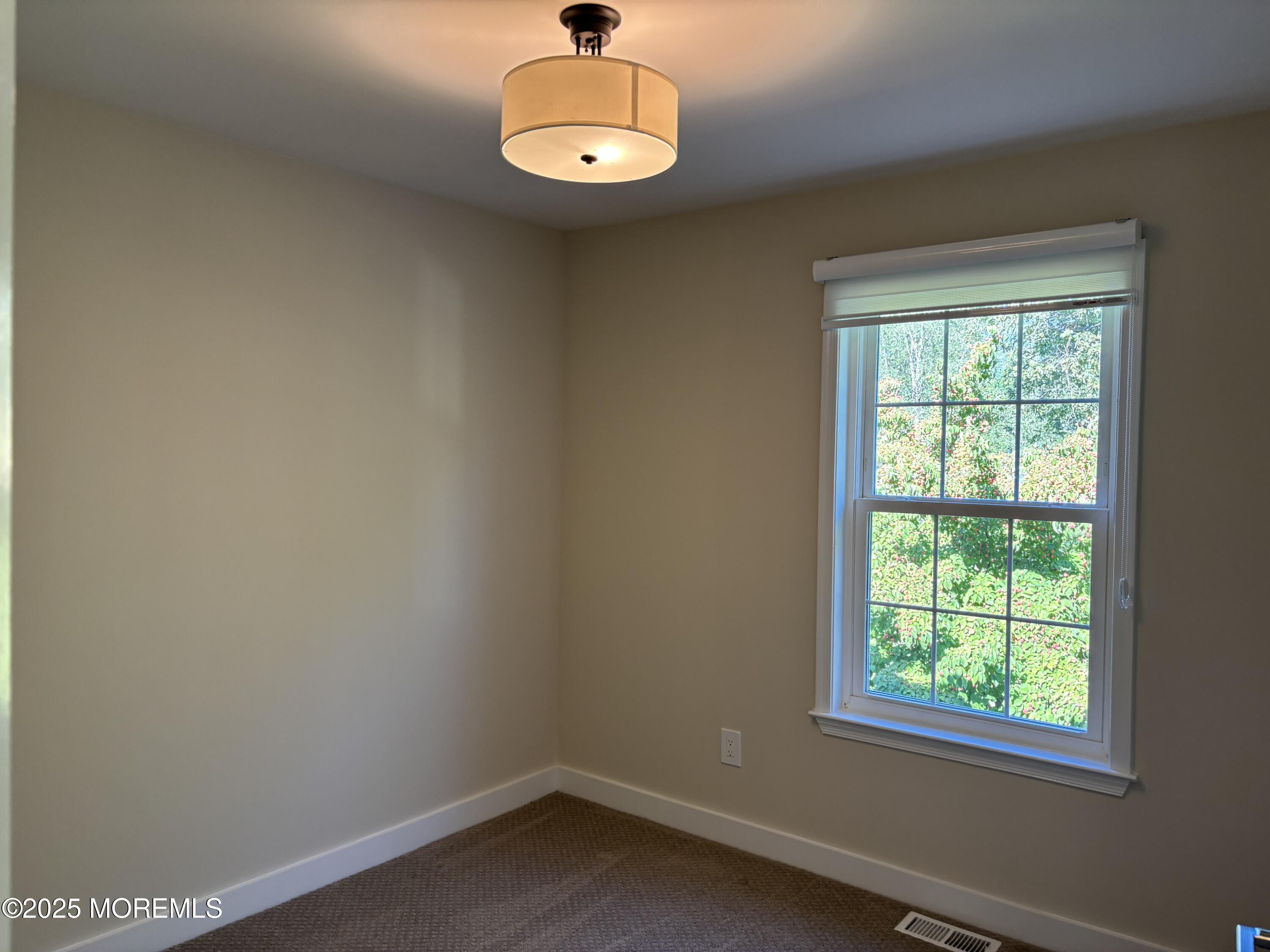 276 Sugar Maple Court Howell, NJ 07731 - Photo 19 of 34 an empty room with a window