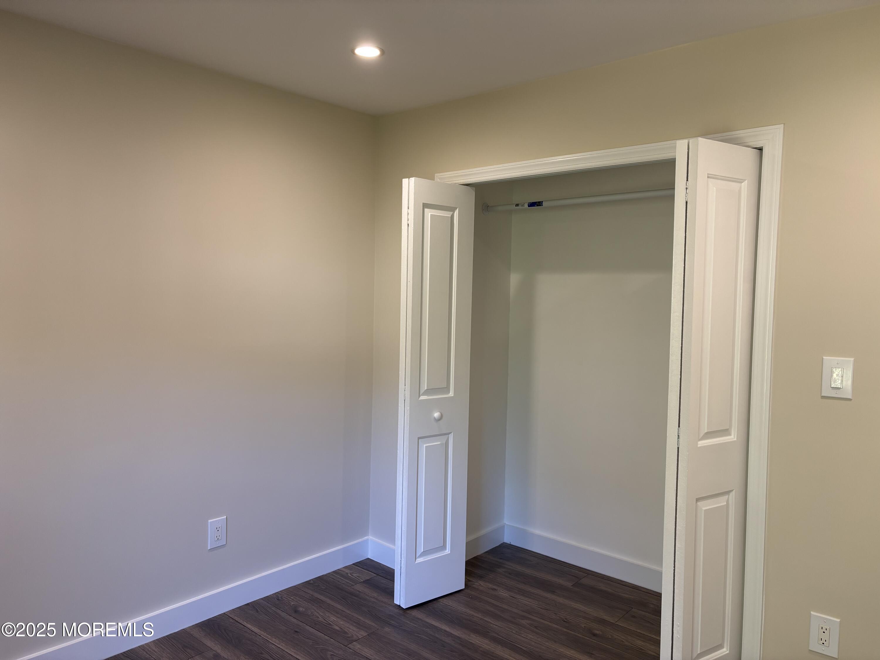 276 Sugar Maple Court Howell, NJ 07731 - Photo 20 of 34 a view of an empty room with wooden floor