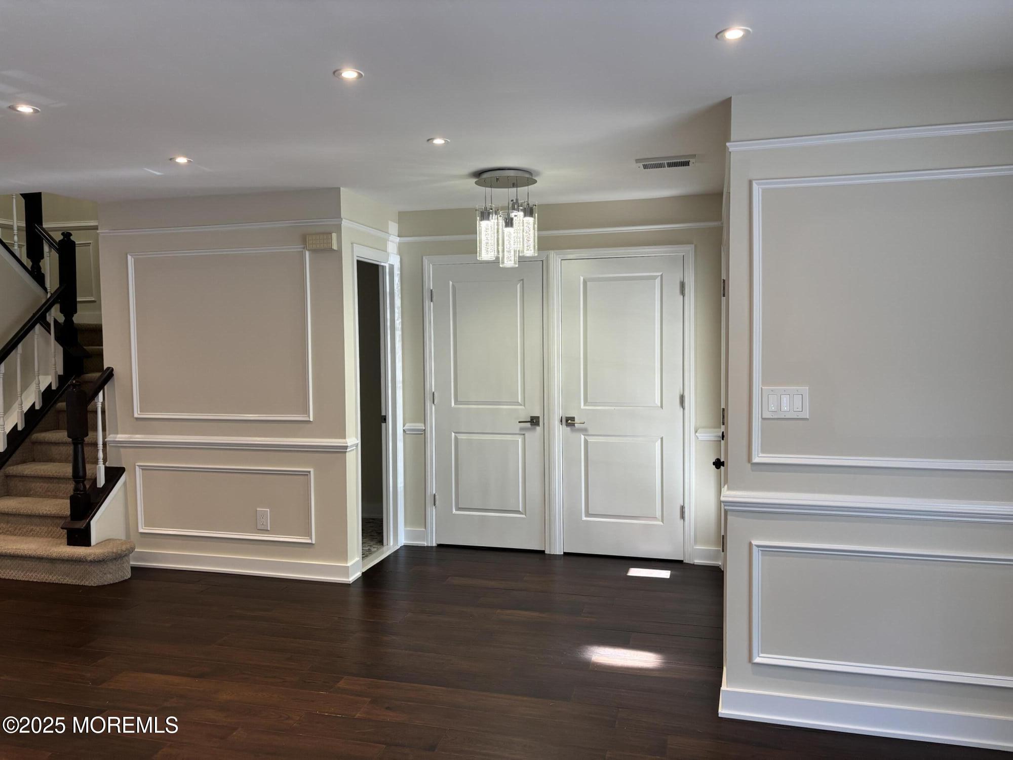 276 Sugar Maple Court Howell, NJ 07731 - Photo 2 of 34 a view of a hallway with wooden floor and closet