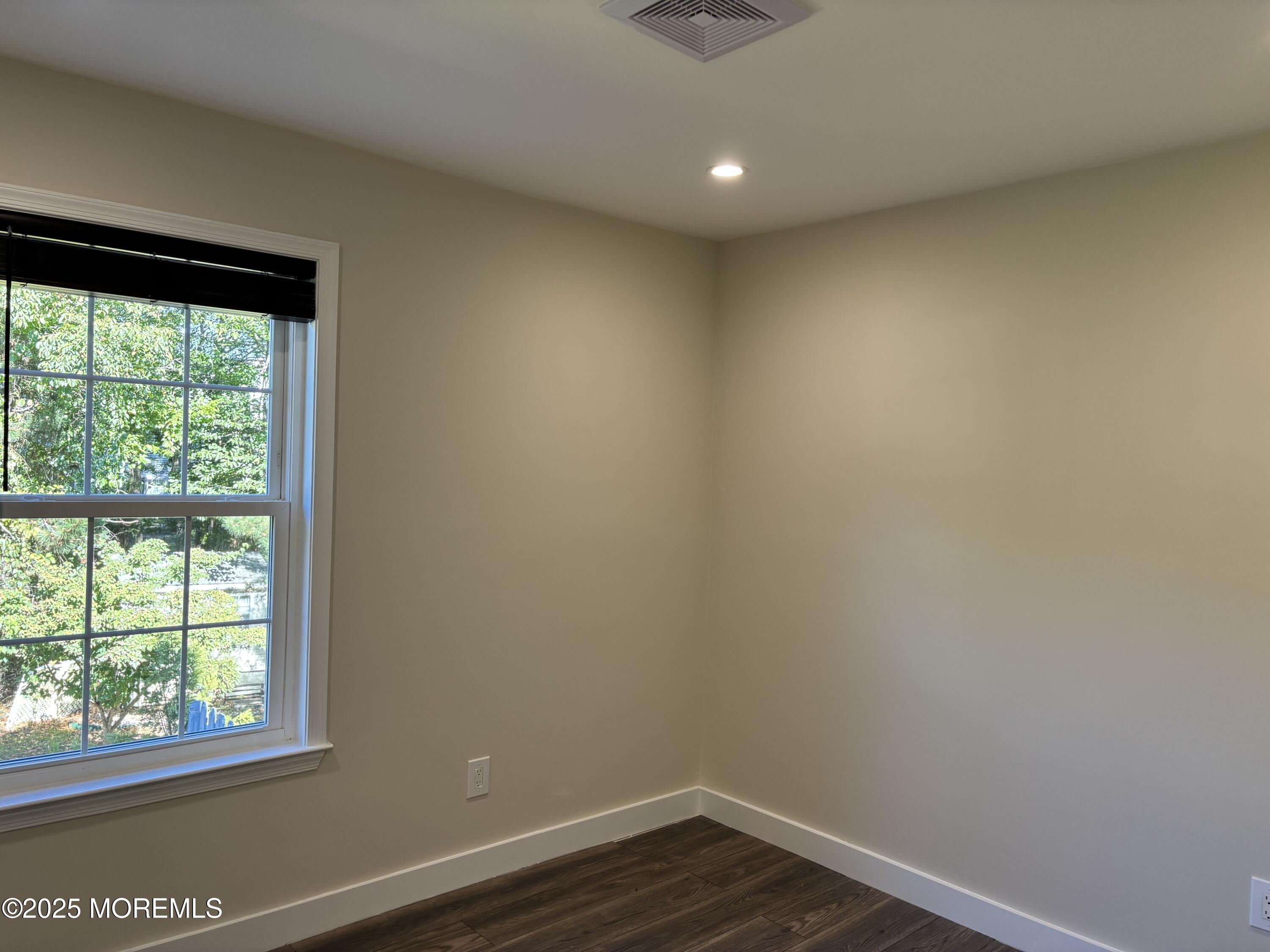 276 Sugar Maple Court Howell, NJ 07731 - Photo 21 of 34 a view of a small space with wooden floor and a window