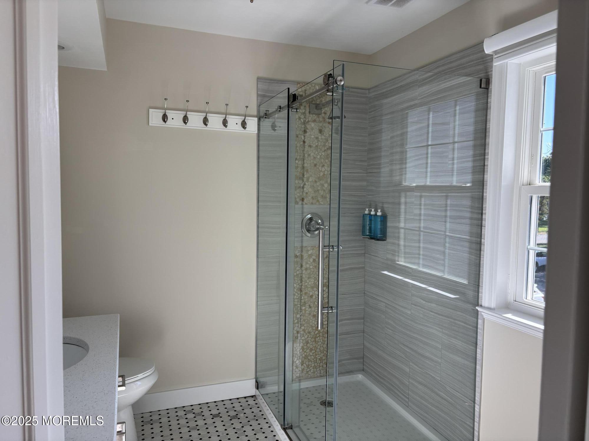 276 Sugar Maple Court Howell, NJ 07731 - Photo 22 of 34 a bathroom with a shower and a toilet