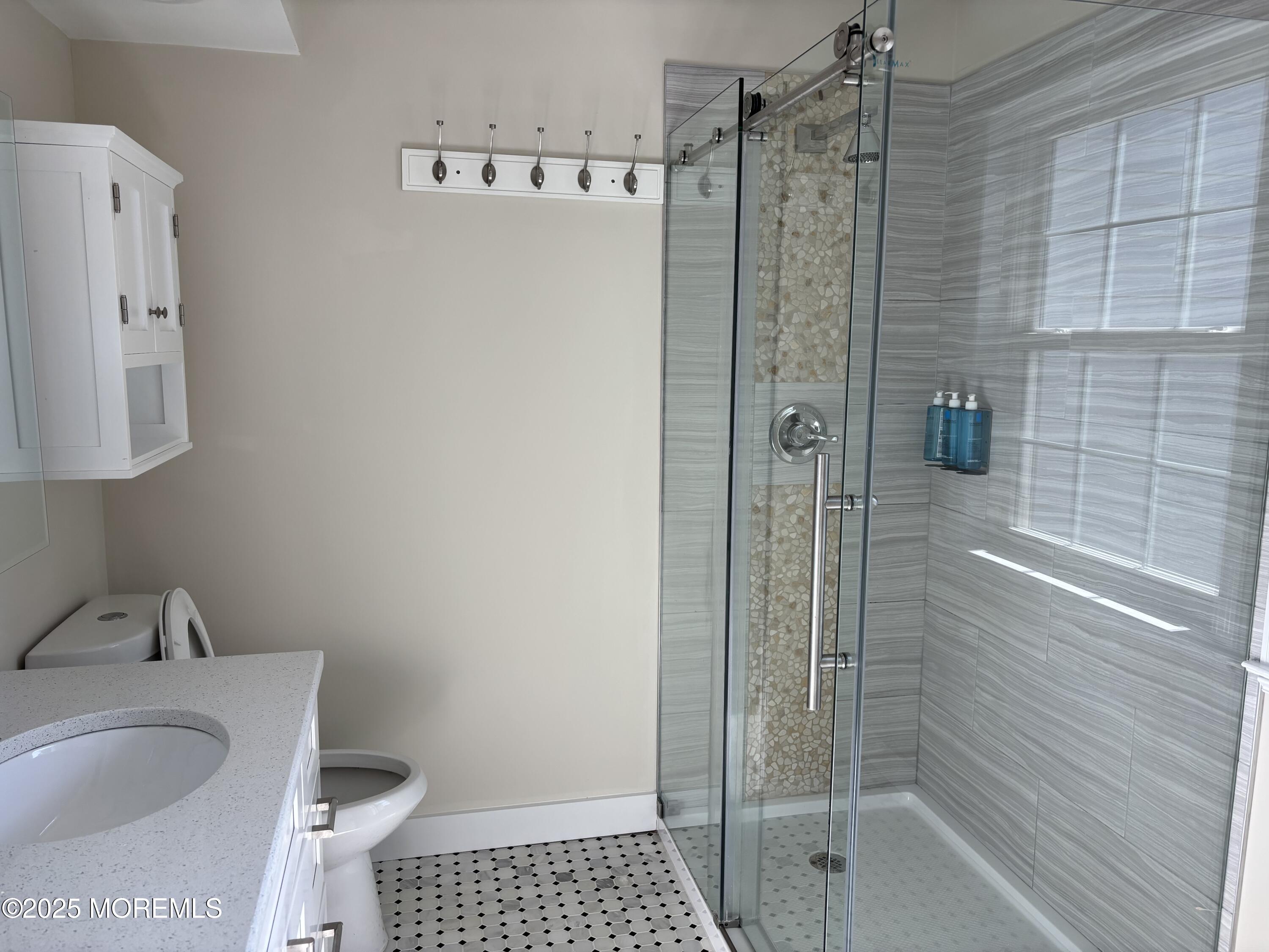 276 Sugar Maple Court Howell, NJ 07731 - Photo 25 of 34 a bathroom with a shower and a sink