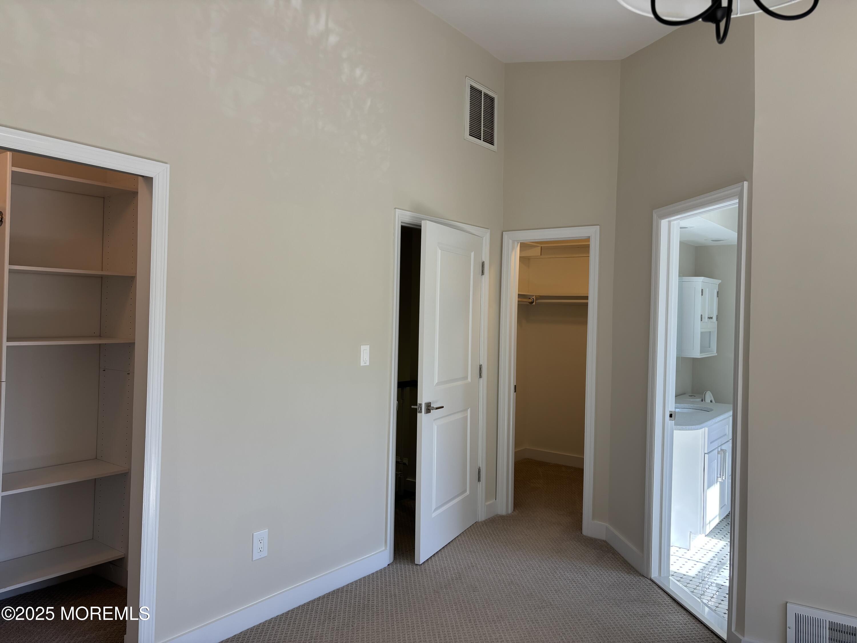 276 Sugar Maple Court Howell, NJ 07731 - Photo 26 of 34 a view of a room with a door and a closet