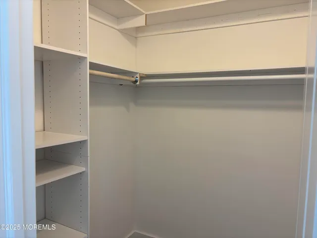 a view of an empty walk in closet