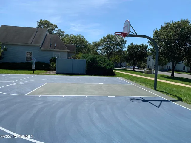 a swimming pool with trees in front of it