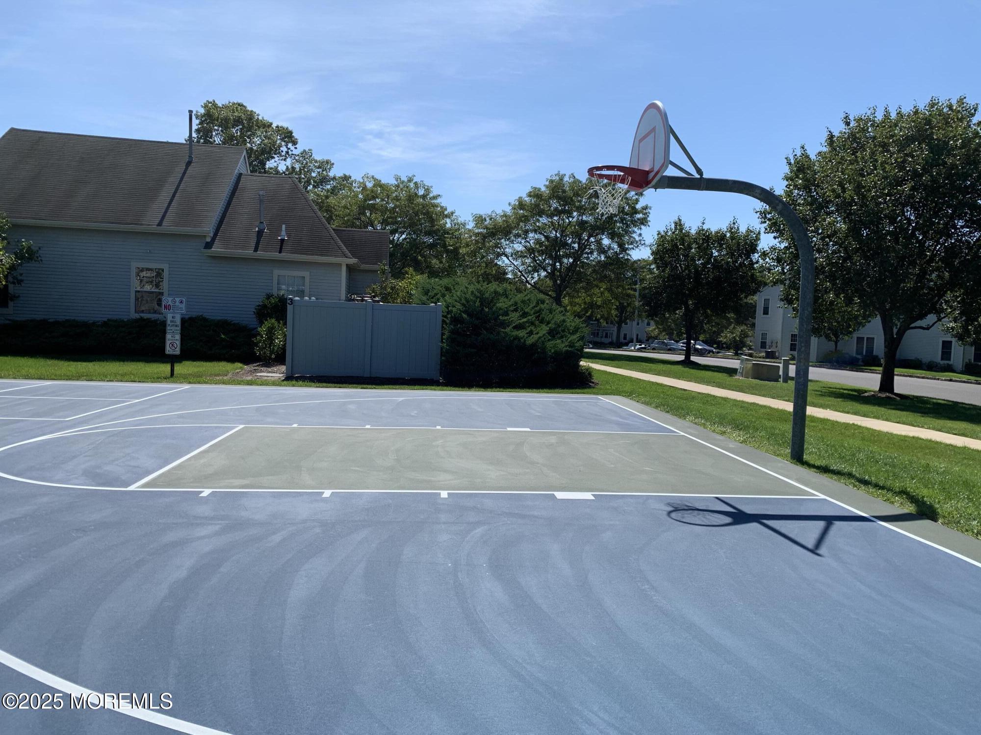 276 Sugar Maple Court Howell, NJ 07731 - Photo 33 of 34 a swimming pool with trees in front of it