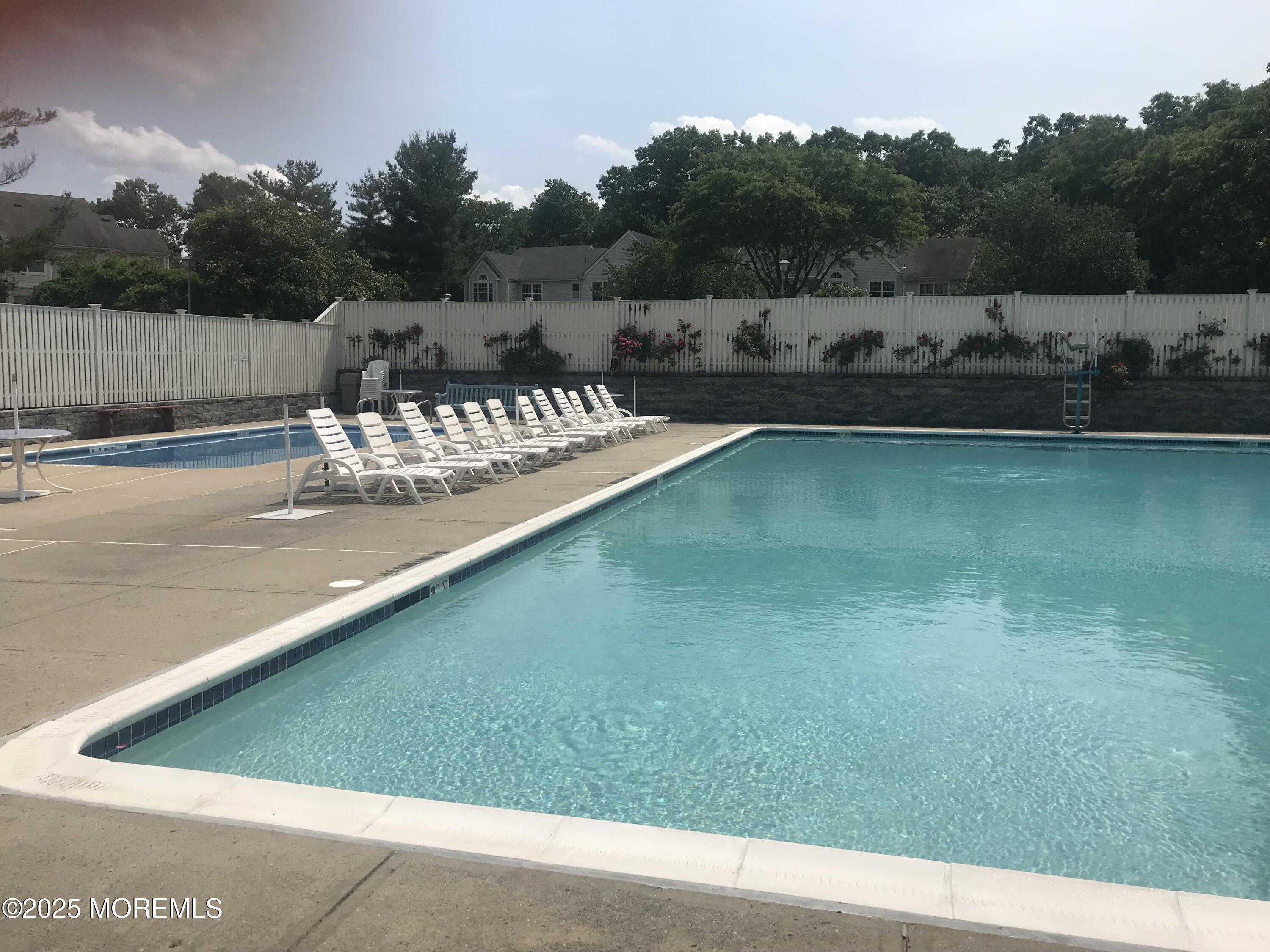 276 Sugar Maple Court Howell, NJ 07731 - Photo 34 of 34 a view of a garden with lawn chairs