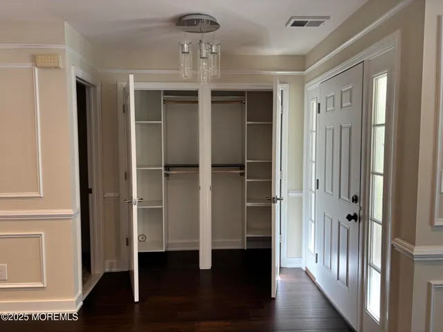 a view of entryway with wooden floor