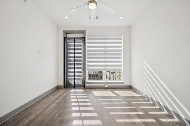 a view of kitchen with sink refrigerator and cabinets