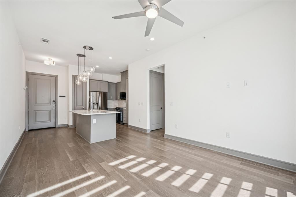2700 Old Denton Road, Unit 4451 Carrollton, TX 75007 - Photo 13 of 38 a view of kitchen with sink refrigerator and cabinets