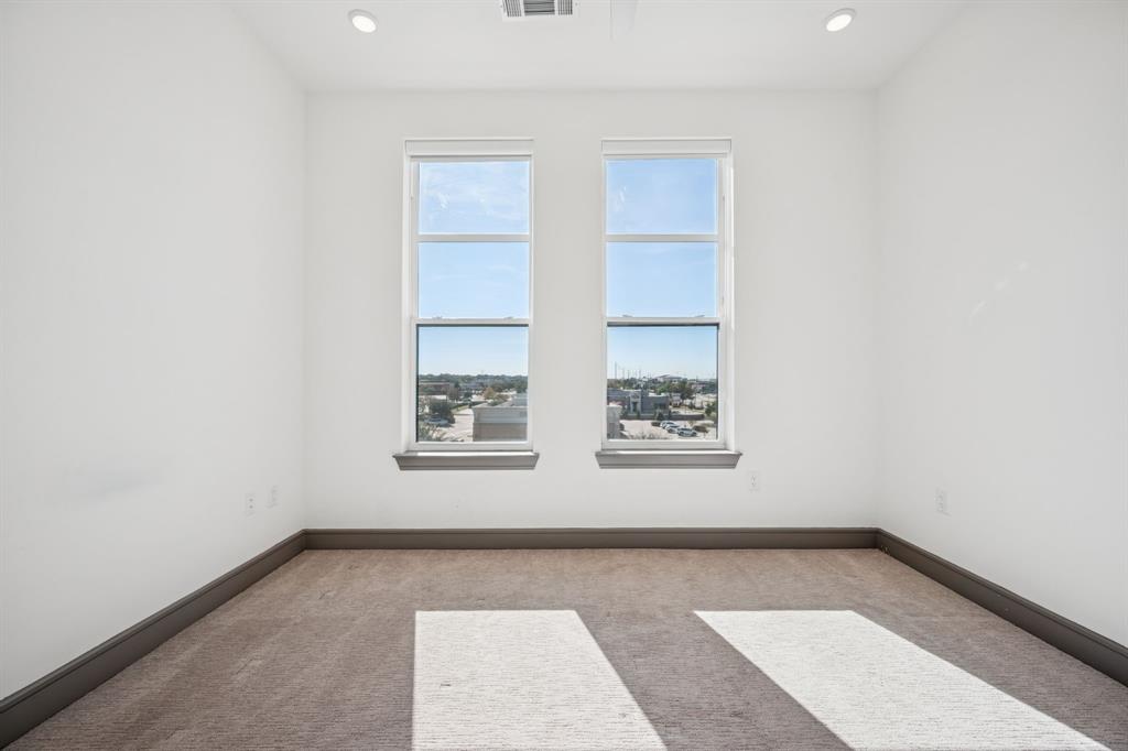 2700 Old Denton Road, Unit 4451 Carrollton, TX 75007 - Photo 16 of 38 an empty room with windows