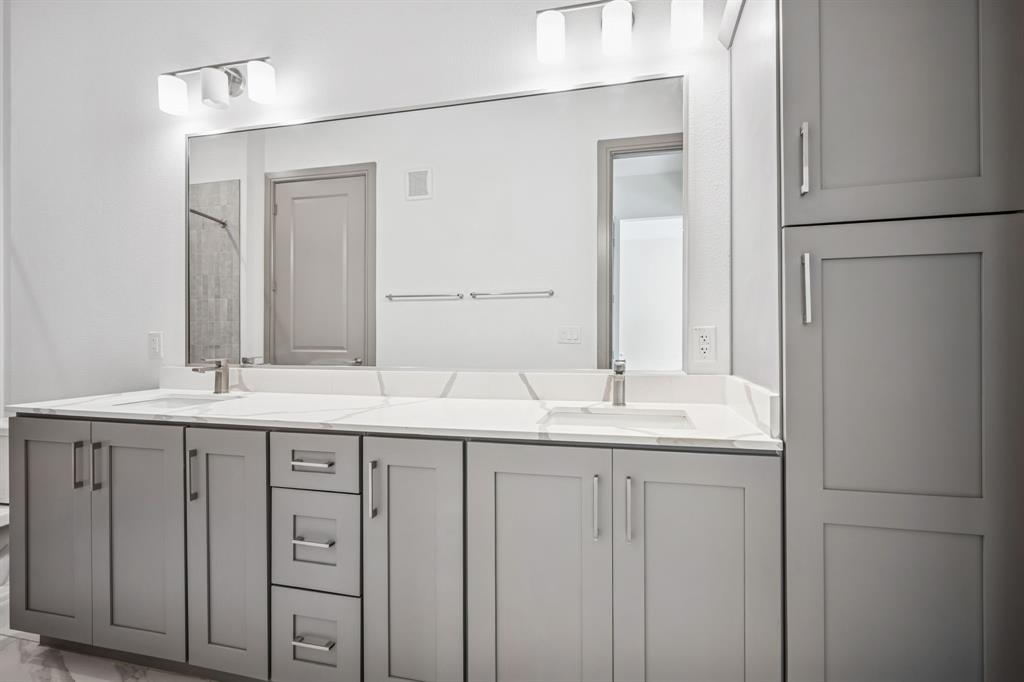2700 Old Denton Road, Unit 4451 Carrollton, TX 75007 - Photo 18 of 38 a bathroom with a double vanity sink and mirror