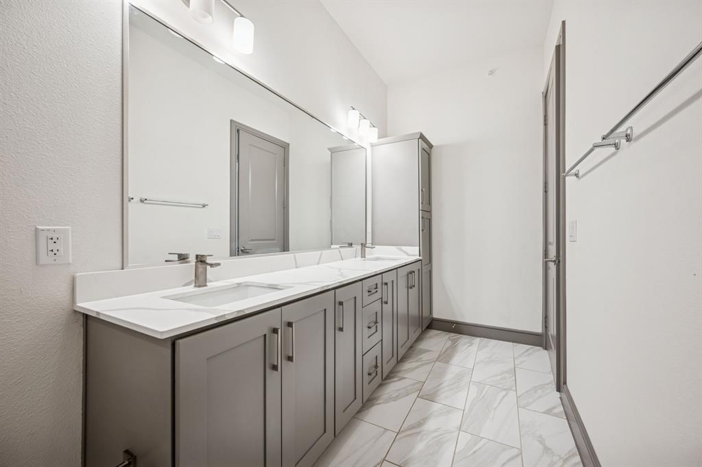 2700 Old Denton Road, Unit 4451 Carrollton, TX 75007 - Photo 21 of 38 a bathroom with a sink and a mirror