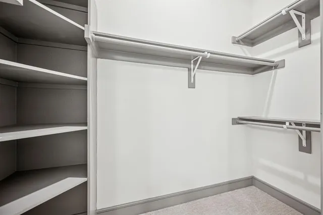 a view of a hallway with washer and dryer
