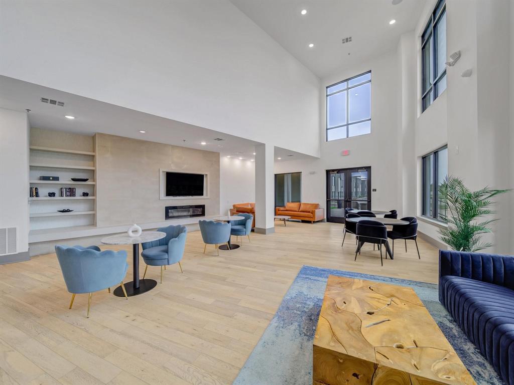 2700 Old Denton Road, Unit 4451 Carrollton, TX 75007 - Photo 30 of 38 a living room with furniture and a flat screen tv