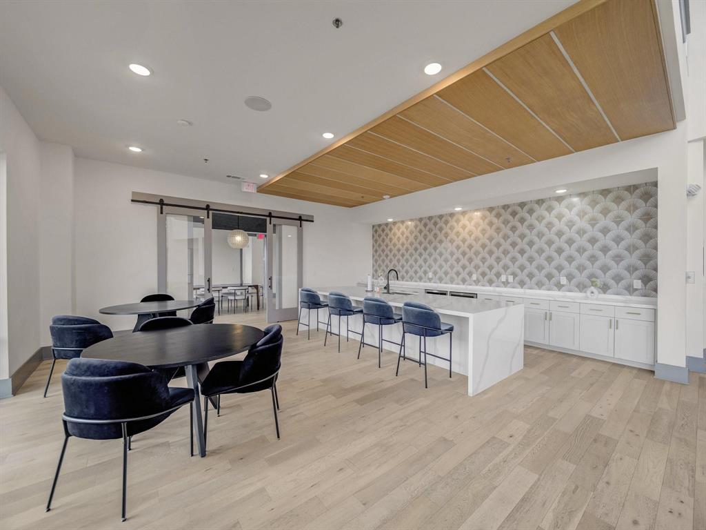 2700 Old Denton Road, Unit 4451 Carrollton, TX 75007 - Photo 31 of 38 a living room with furniture and a wooden floor
