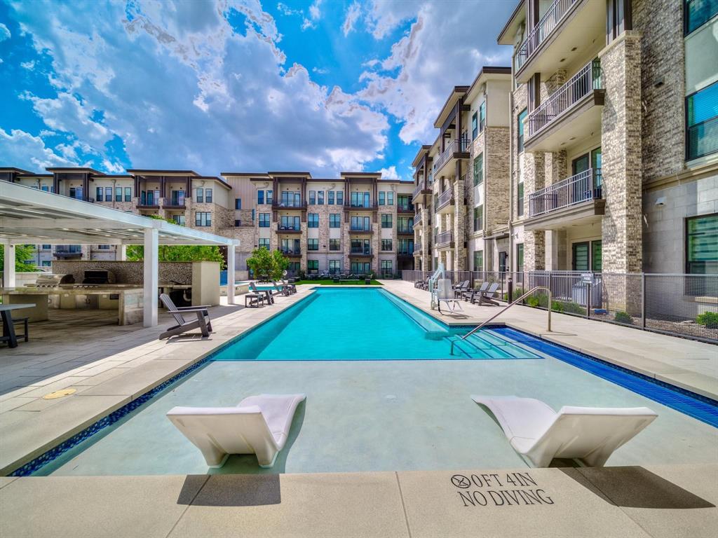 2700 Old Denton Road, Unit 4451 Carrollton, TX 75007 - Photo 35 of 38 a view of a building with a swimming pool