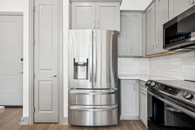 a kitchen with appliances and cabinets