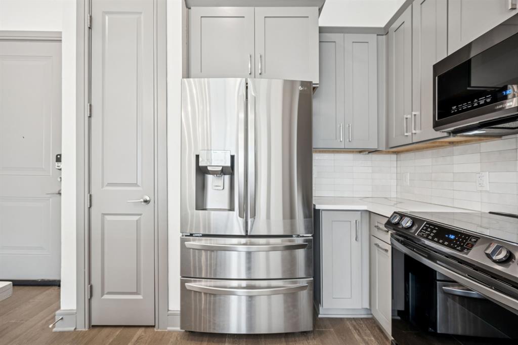 2700 Old Denton Road, Unit 4451 Carrollton, TX 75007 - Photo 9 of 38 a kitchen with appliances and cabinets