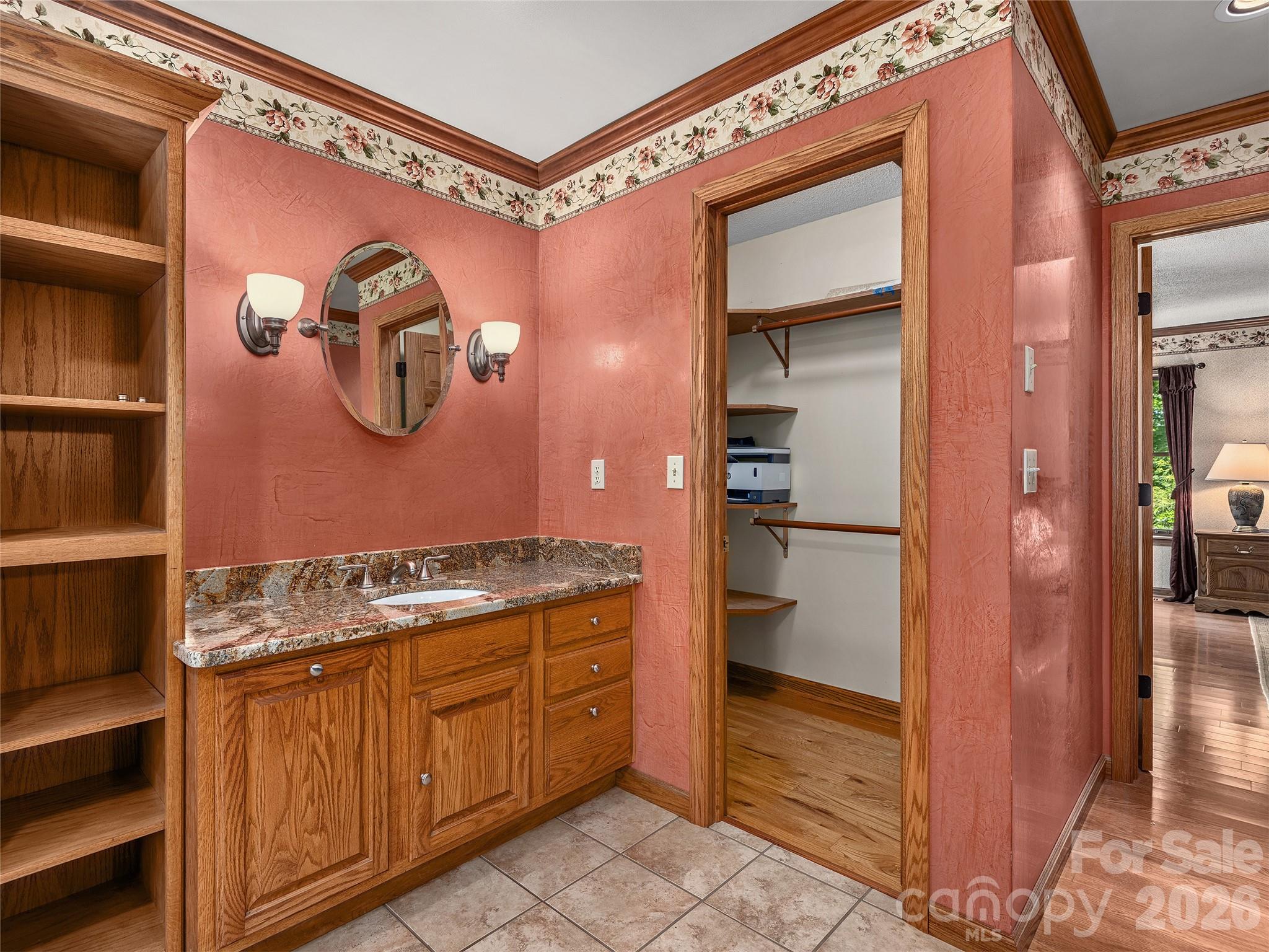 40 Deer Ridge Road Mills River, NC 28759 - Photo 22 of 35 a bathroom with a granite countertop sink and a mirror